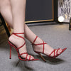 Stiletto heels with pointed cross