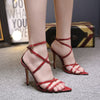 Stiletto heels with pointed cross