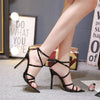 Stiletto heels with pointed cross